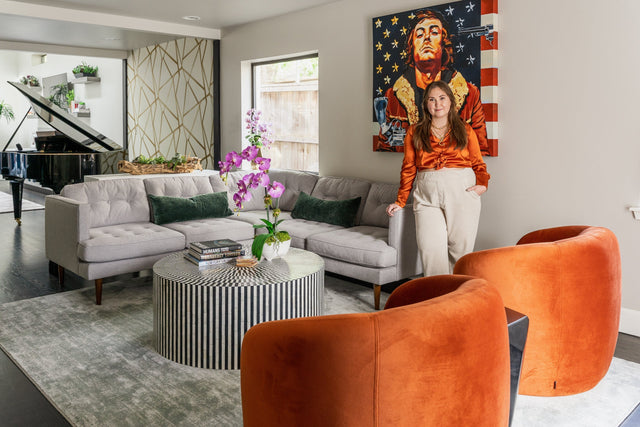 Sleek and stylish modern living room with an open layout, neutral tones, large windows, and contemporary furniture for a polished look.